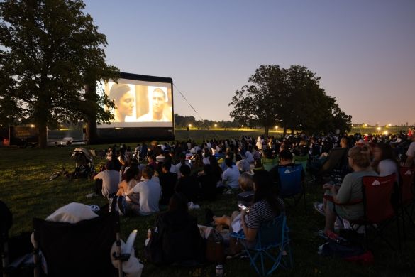 Crowd watching movie screen Crowd watching movie screen