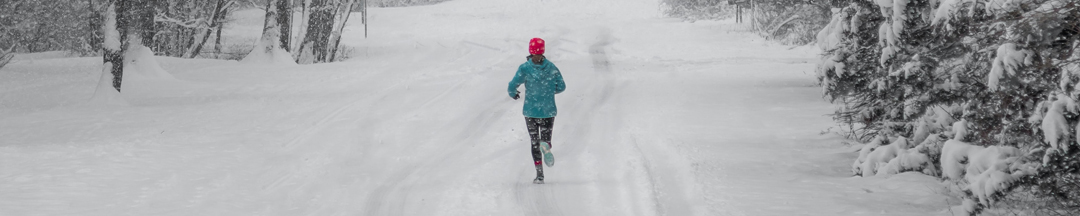A person jogging in the snow.