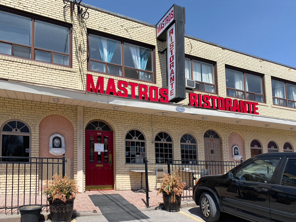 A restaurant with a sign that says &quot;Mastros Ristorante.&quot;