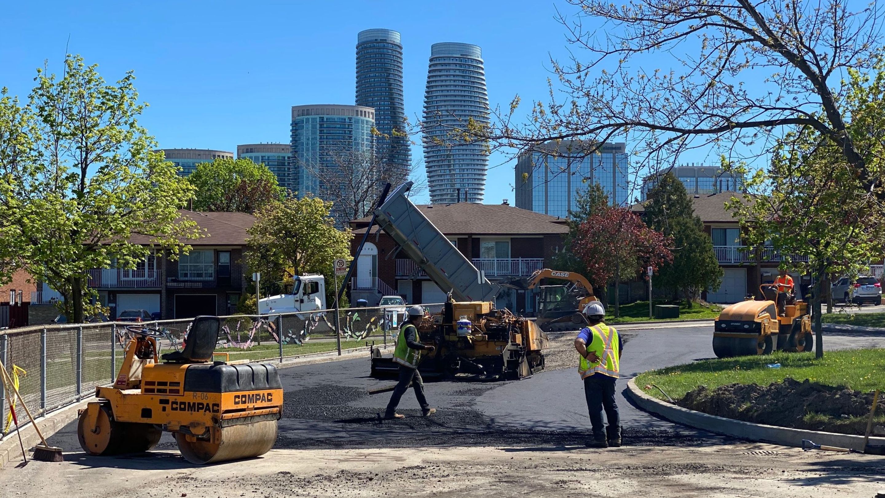 Workers putting in new paving.