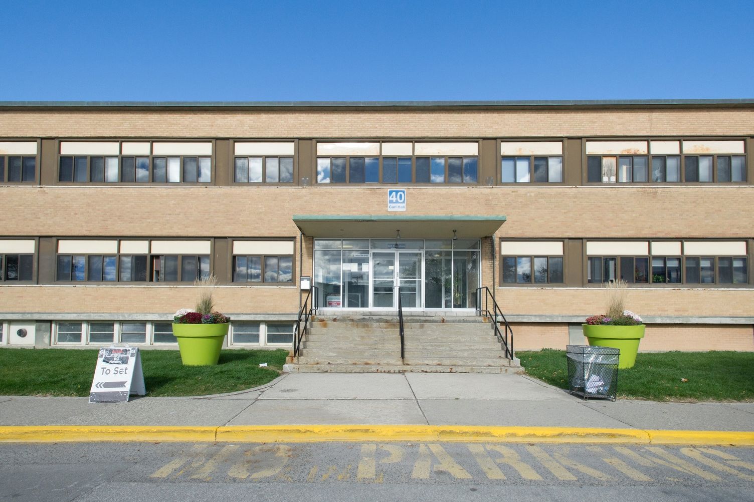 A beige building along Carl Hall Road.