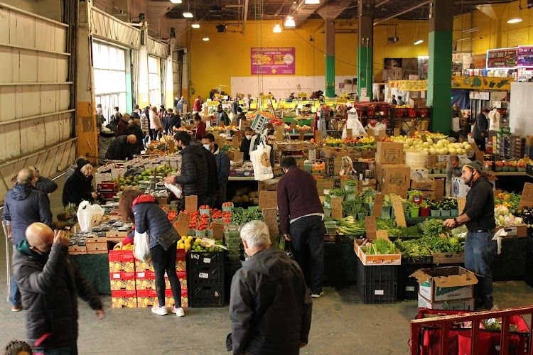 Fruits and veggies for sale in an indoor market. 