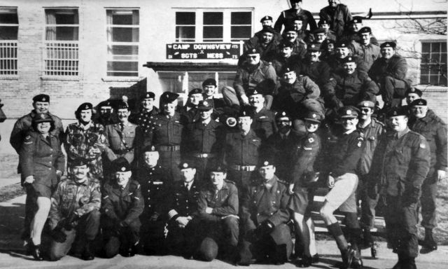 A black and white photo of a group of military personnel.