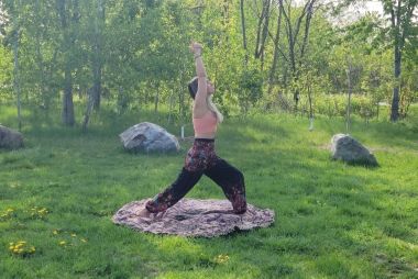 A person doing yoga outdoors