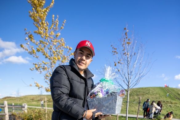 A prize winner posing with his dog.