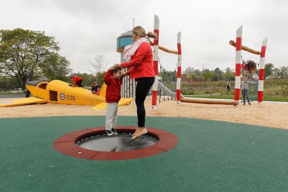 A mom and her kid bouncing on a mini-trampoline at the Play Zone.